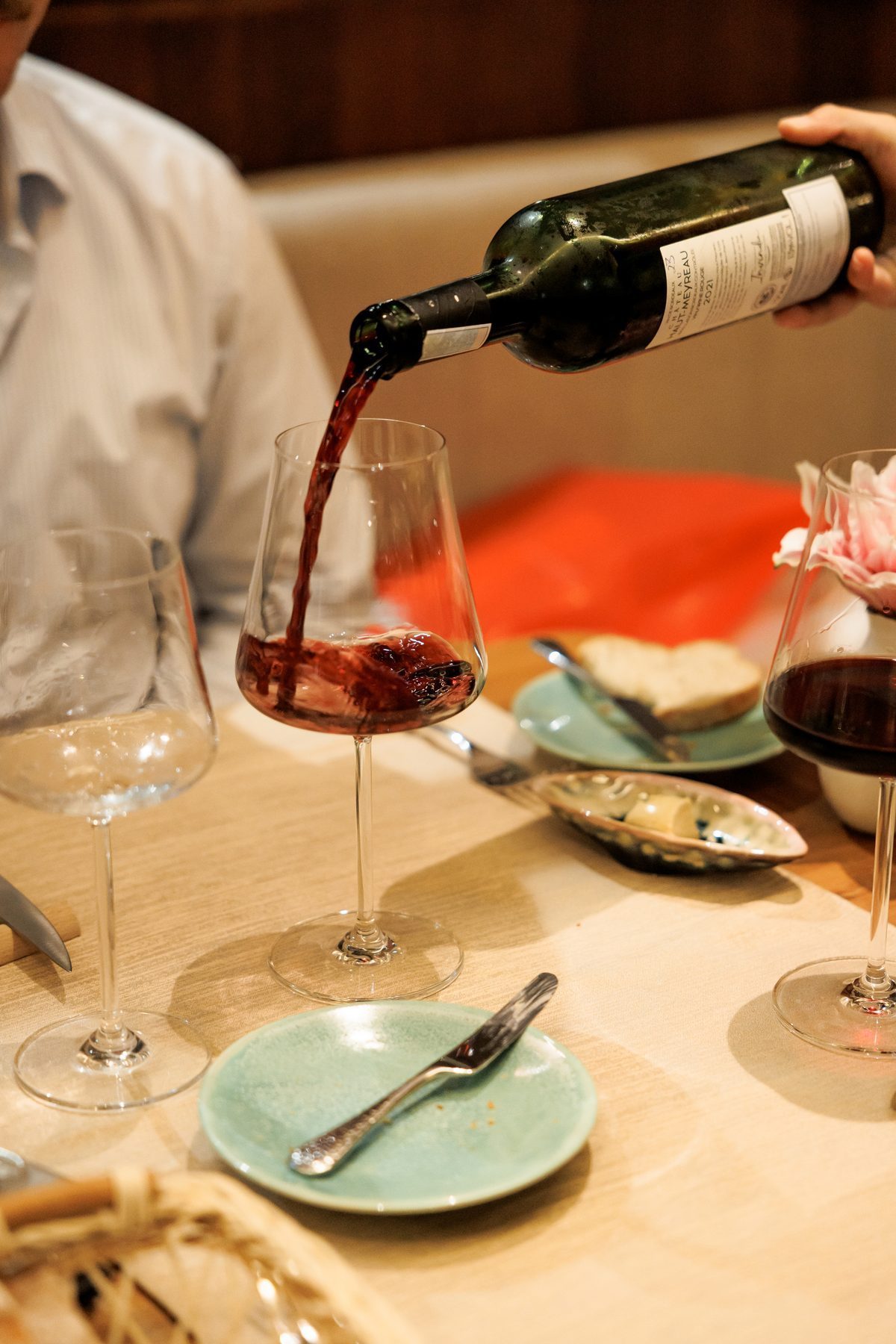 Guests toasting with red wine